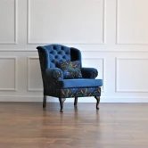Pikowany fotel uszak chesterfield